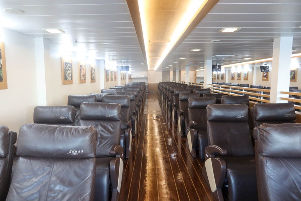 Rows of squashy, fully reclining seats in the VIP lounge on the ferry