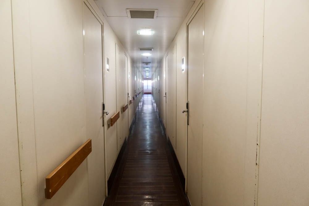 A corridor with cabins on either side on the Palma to Barcelona boat