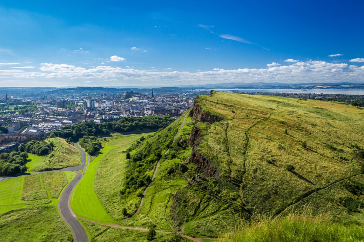 Edinburgh and green hills in summer.