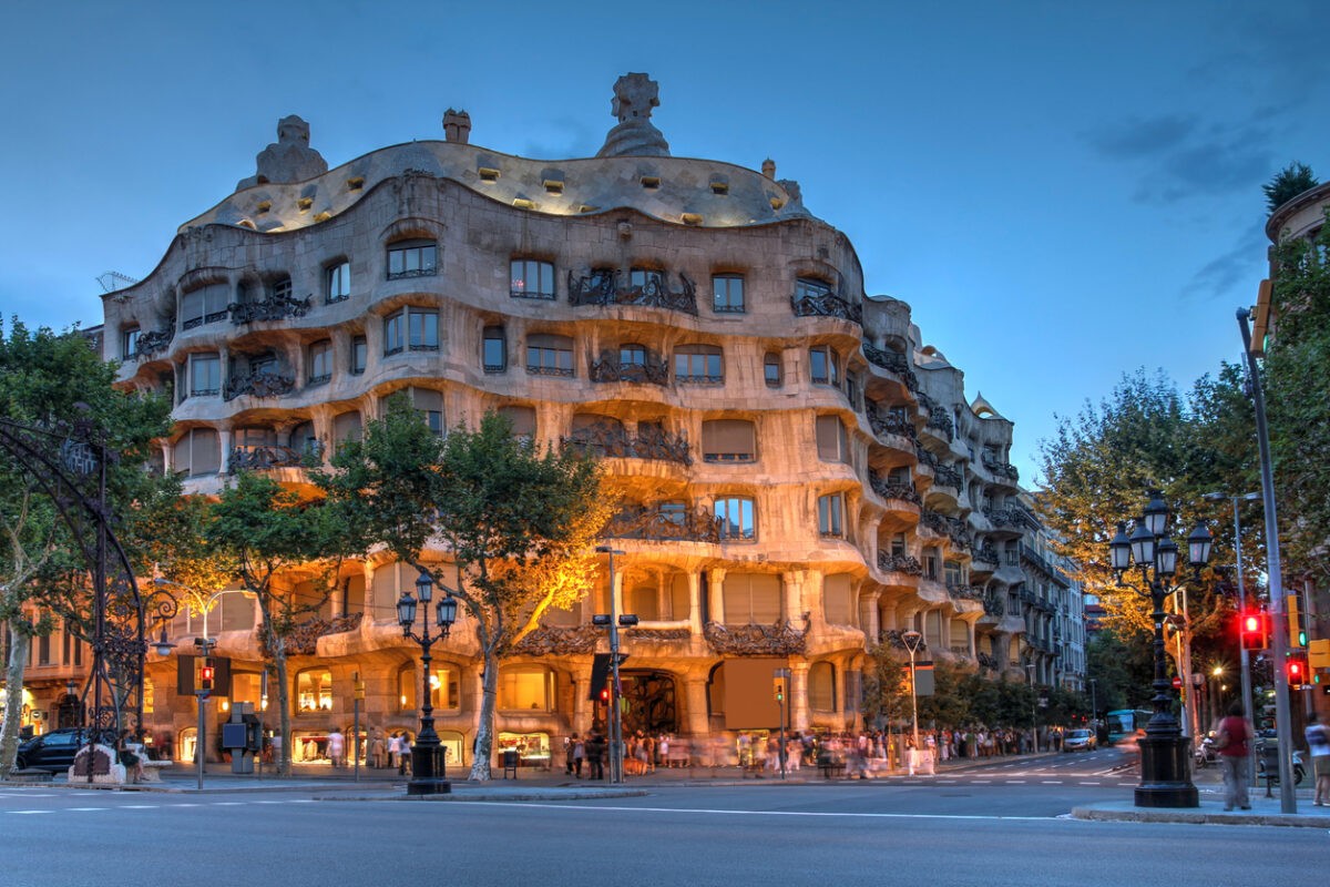 Barcelona, Spain - July 28, 2012: Twilight scene of Casa Mila (La Pedrera) in Eixample, Barcelona on July 28, 2012. Casa Mila an apartment building, is one of Antoni Gaudi's most famous works.