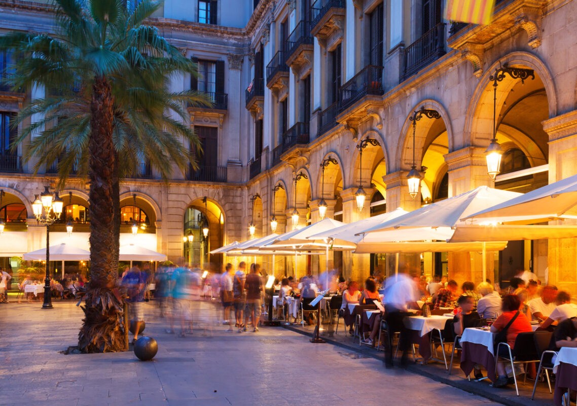 night view of Placa Reial with restaurants in summer. Barcelona