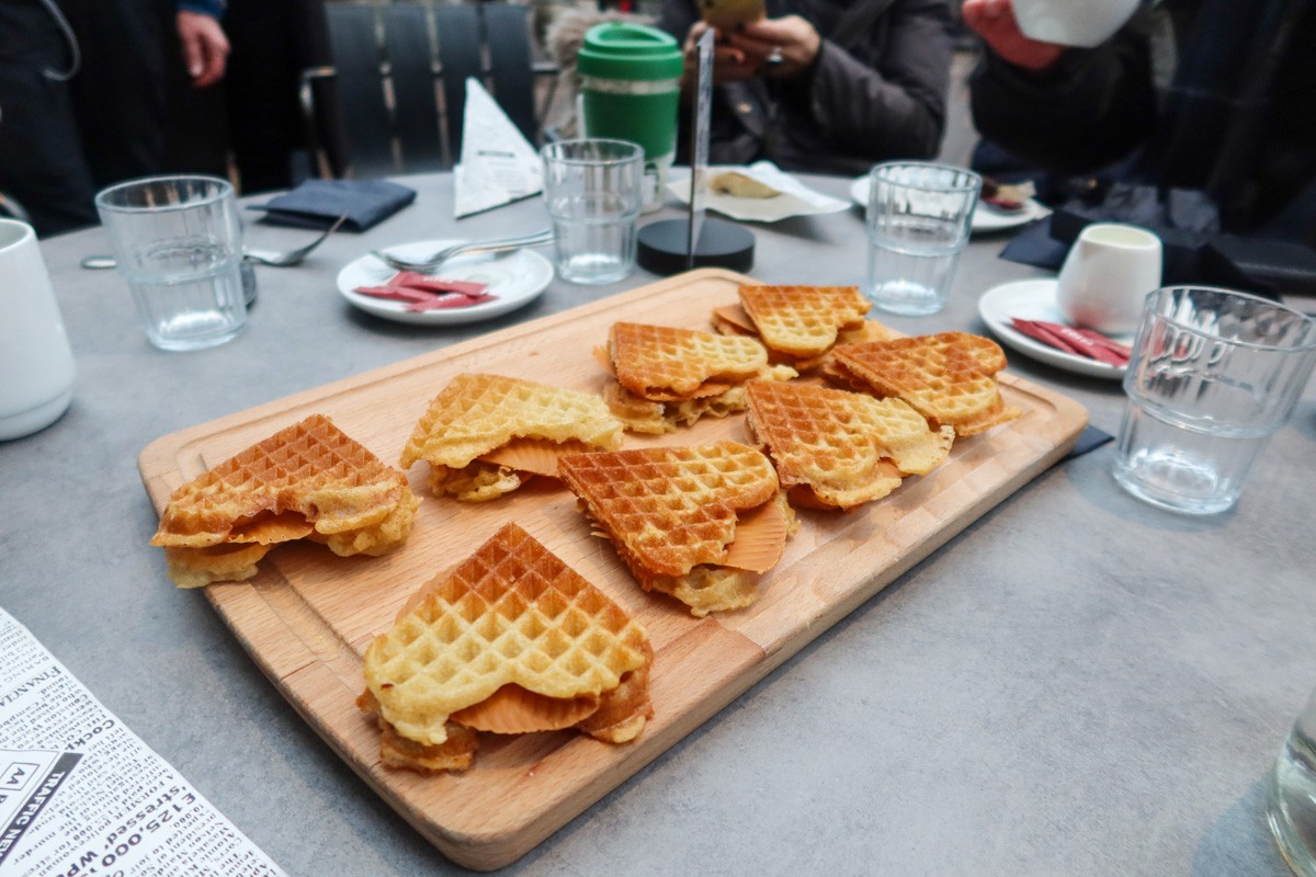heart-shaped waffles sitting on a table with Norwegian brown cheese on the inside