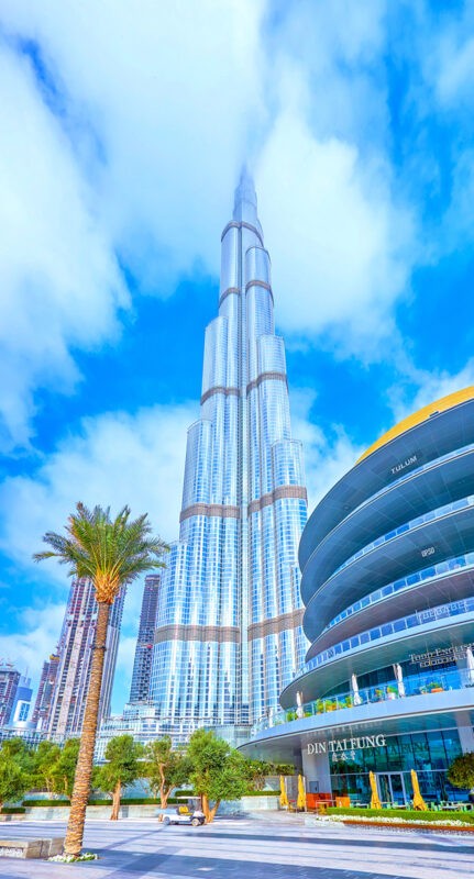 DUBAI, UAE - MARCH 3, 2020: The walking boulevard at Dubai Mall shopping center with Burj Khalifa building on background, on March 3 in Dubai